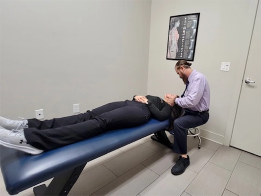 Chiropractor San Antonio TX Paul Narvid Adjusting Patient